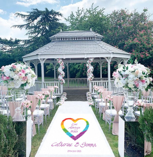 A beautiful wedding aisle runner with a Rainbow and the text 