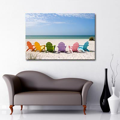 Beach chairs on a beach Art Canvas